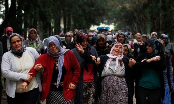 Relatives of Ahmet Uyan and Ahmet Ceyhan who were killed in yesterday's car bombings, mourn in the town of Reyhanli of Hatay province near the Turkish-Syrian border