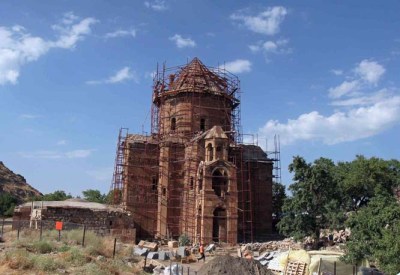 ** file ** the 1,000-year-old akhtamar church, one of the finest surviving monuments of ancient armenian culture, is covered in scaffolding as masons replace fallen roof stones in van province in east turkey, in this july 23, 2005 file photo. after a century of neglect and political wrangling, turkey has restored the ancient church, the lone building on the tiny akhtamar island. turkey may host armenian officials at a ceremony marking the renovation of the chuch, turkish media and sources close to the project said wednesday, march 14, 2007. (ap photo/burhan ozbilici/file)